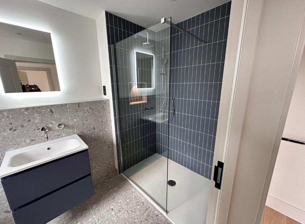 4 Rosefield — en-suite with terrazzo and dark shower tile